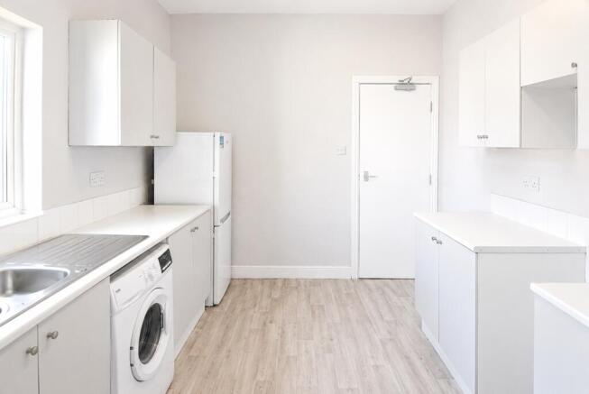 Bright modern kitchen with ample storage space...