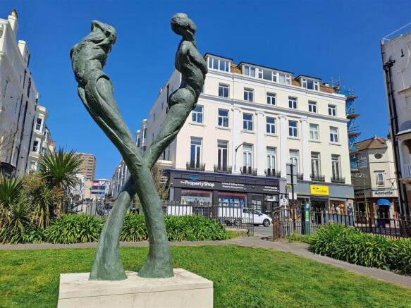 Statue and Front of Building