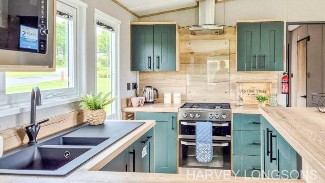 Stylish green fitted kitchen in ABI Ingleton stati