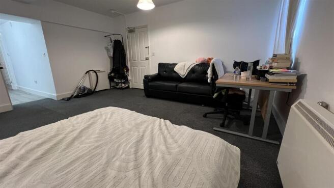 Spacious room with study desk and comfy sofa...