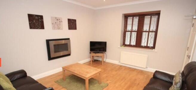 Bright, well-presented living room with wooden ...