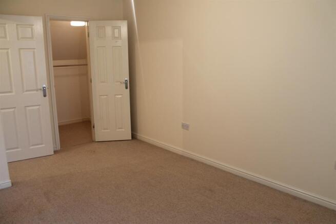 main bed and walk in wardrobe
