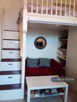 Platform Bed Above Seating Area