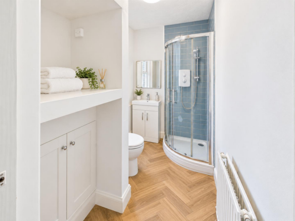 White, Blue, and Oak Shower Room.png