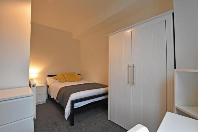 Modern bedroom with stylish white furniture...