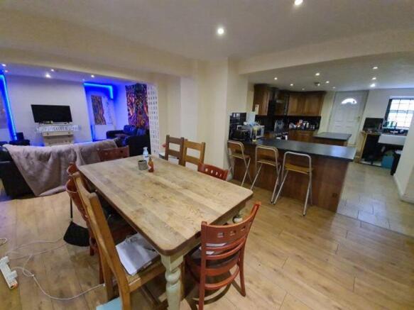 A spacious and modern living area with an open-...