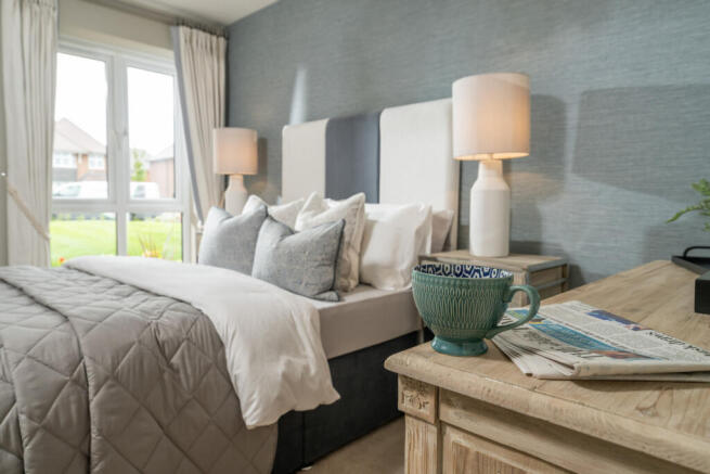 a bedroom with a bed and a coffee table