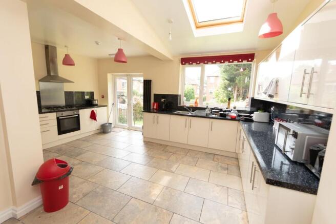 Bright and spacious kitchen with large windows ...