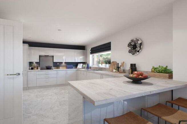 Modern fitted kitchen with ample storage & a convenient breakfast bar