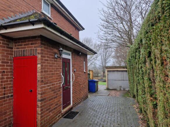 Entrance to property and garage front