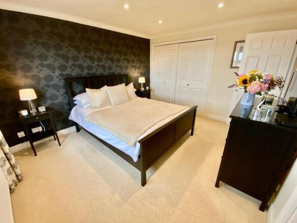 Main bedroom with fitted wardrobes