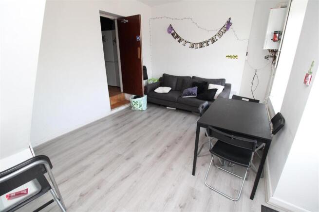 Bright living area with modern wood flooring...