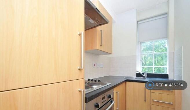 Kitchen: Cooker, Washing Machine, Fridge