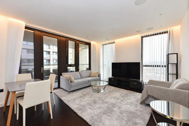 Tidied living room with clear surfaces.png