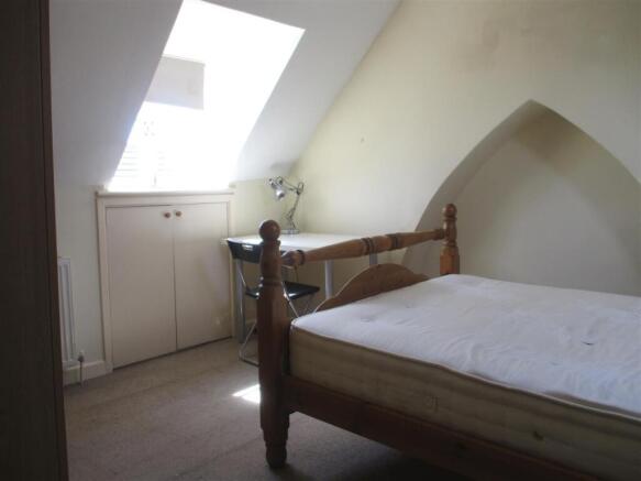 Bright bedroom with desk and unique alcove...