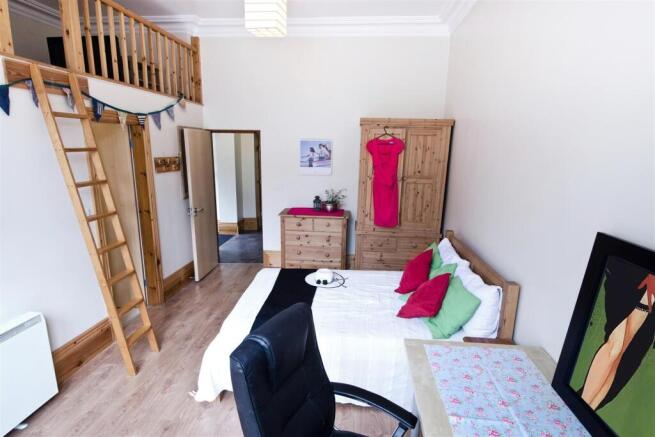 Spacious bedroom with unique mezzanine level...