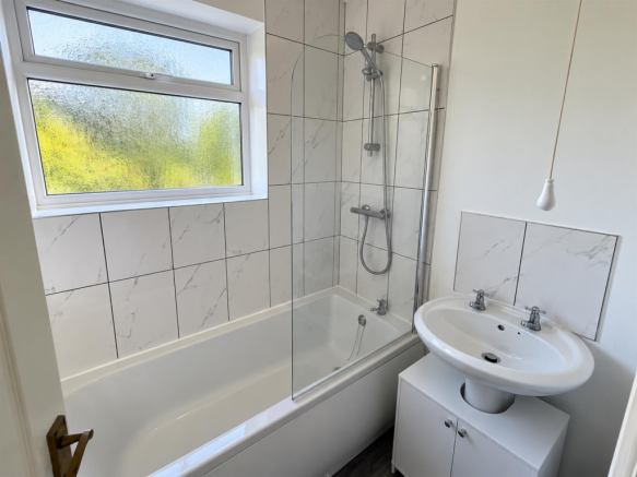 Bright Modern Marble-Tiled Bathroom.png