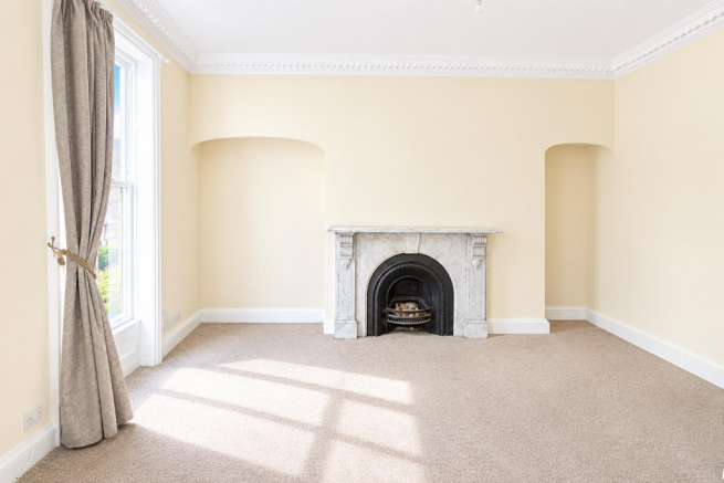 Bright Cream Living Room with Marble Fireplace.png