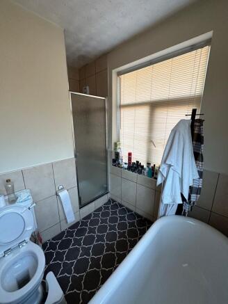 Bright bathroom with bath and walk-in shower...
