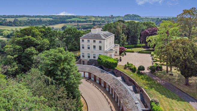 side with garage and pool house