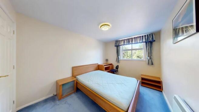 Bright, neatly presented bedroom with a double ...