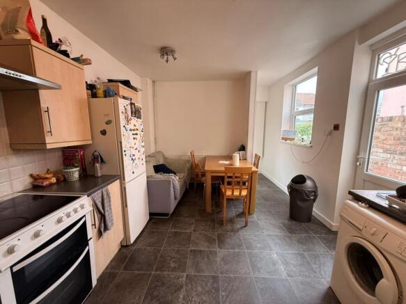 Bright open-plan kitchen/dining area with a fit...