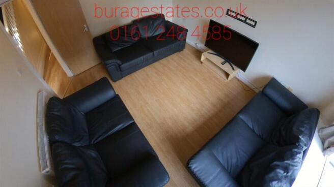 Spacious lounge with comfortable leather sofas...