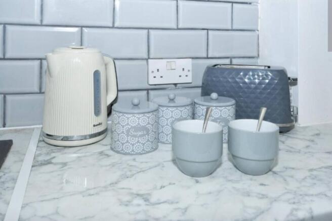 A neat and modern kitchen countertop featuring ...