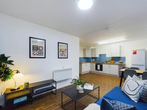 A bright and inviting large modern living room ...