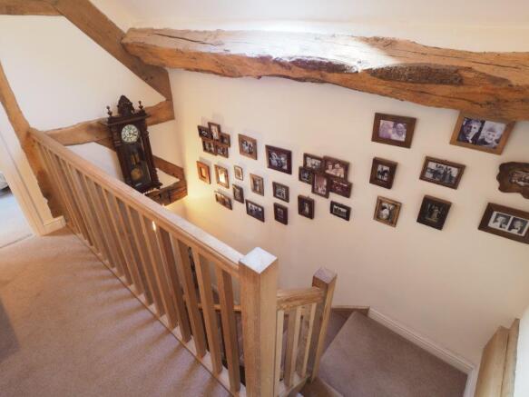 Stairs and landing with exposed timbers