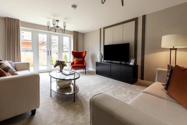 The living room is spacious with space for the whole family to chill out together