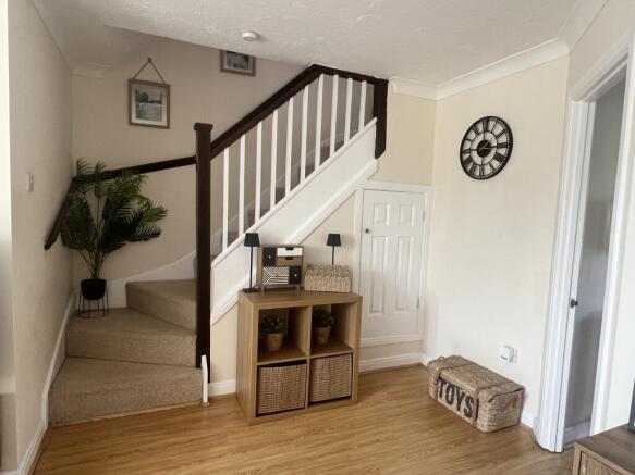 Lounge with stairs leading to first floor