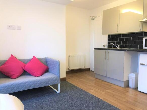 Bright and tidy living area featuring a modern ...