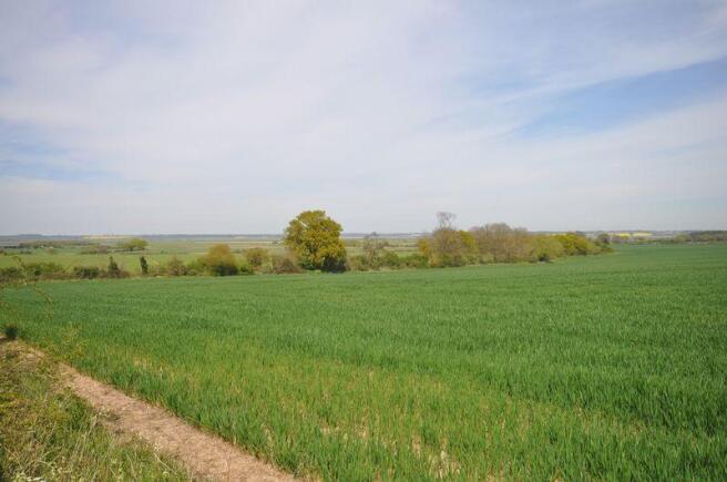 FARMLAND BEHIN...