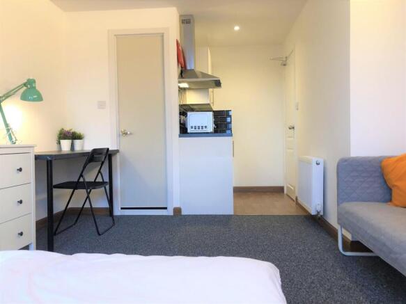 Bright and tidy single bedroom featuring a stud...