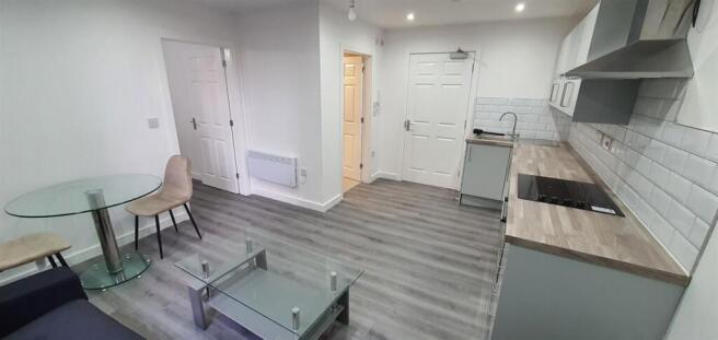 Bright, modern open-plan living area with lamin...