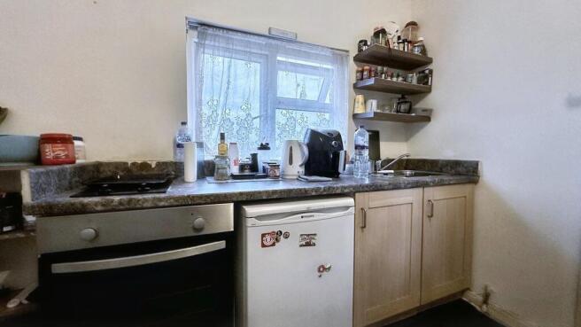 Functional kitchen with essential appliances...