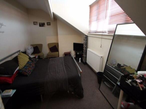 Cozy attic double bedroom with sloped ceiling, ...