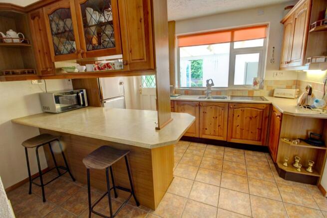 Kitchen showing breakfast bar
