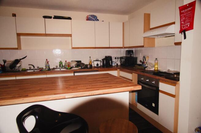 Spacious kitchen with a large breakfast island...