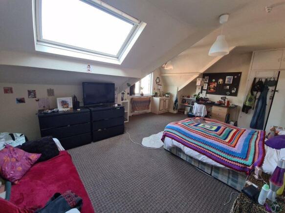 Bright and cozy living room featuring a large w...