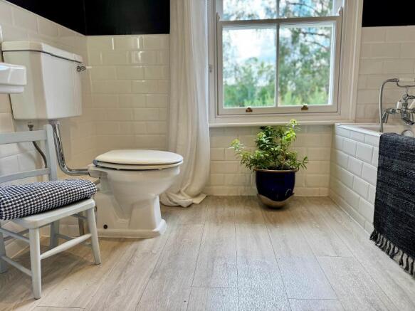 Large bathroom with window and views