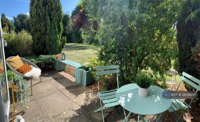 Patio And Communal Garden Beyond