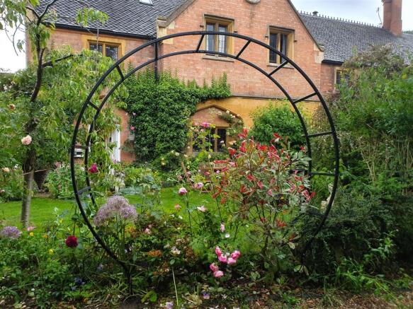 11.  The Coaches, through circular pergola June 20