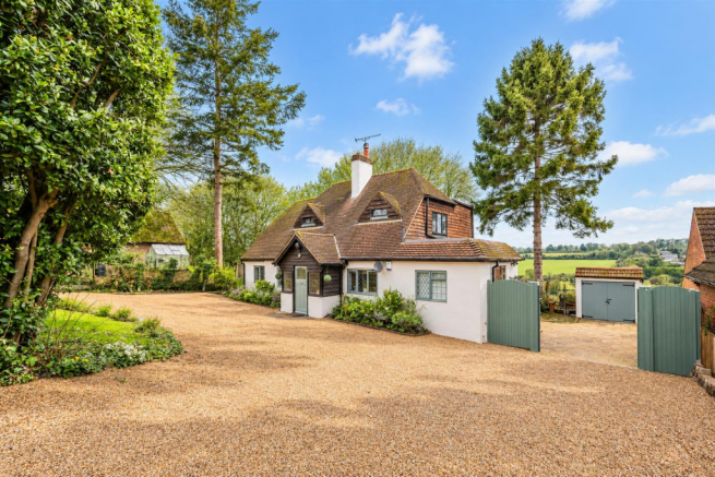 Sunlit English Countryside Cottage.png