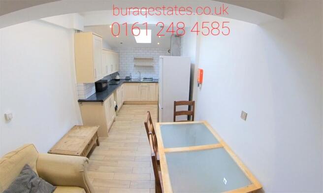 Bright, neatly furnished living/dining area wit...