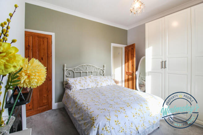 Front bedroom with stairs to loft room
