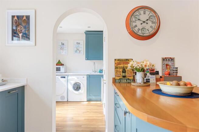Kitchen through to Utility Room