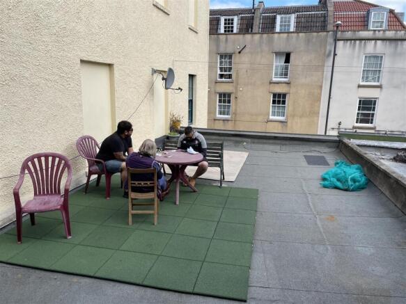 Spacious outdoor terrace with seating area...