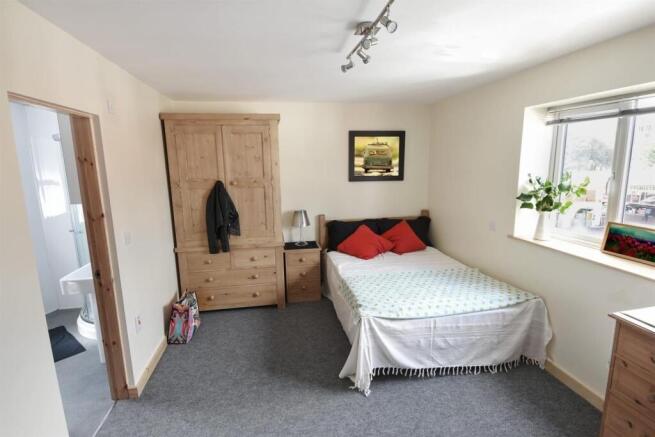 Bright bedroom with ensuite and ample storage...